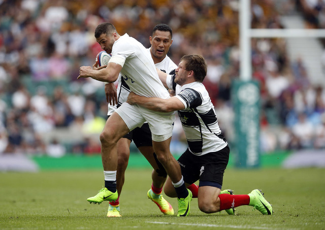 England's Jonny May in action with Barbarians' Frans Steyn